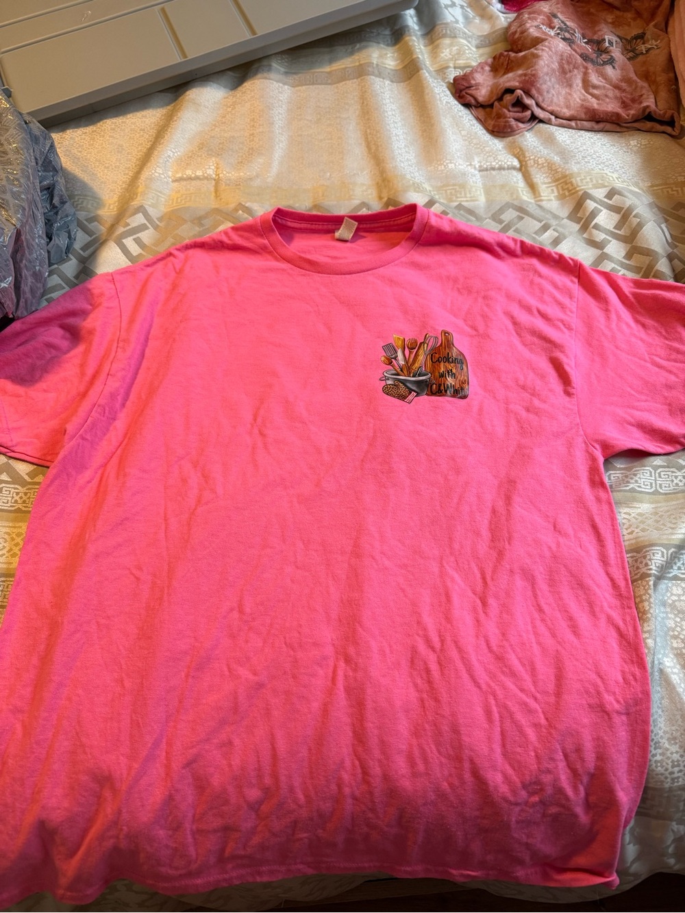 Bright Pink Graphic Tee with Small Chest Design